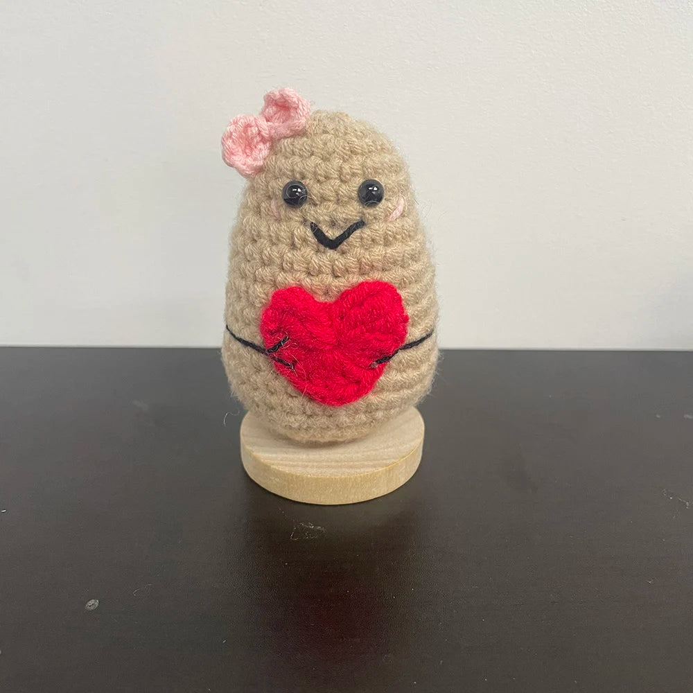 Cute crochet plush doll with red heart and pink bow, perfect handmade amigurumi gift for Valentine's Day or loved ones